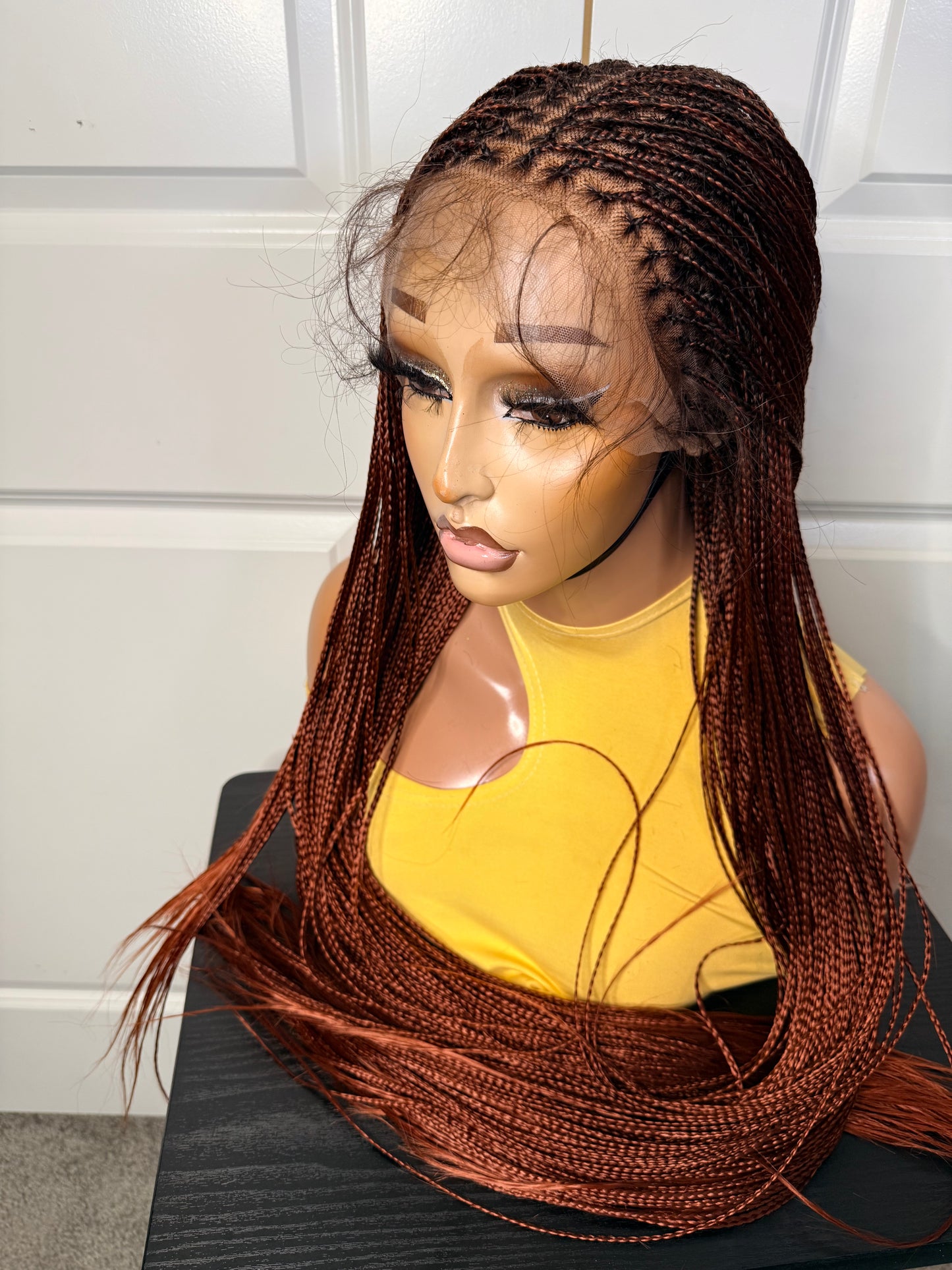 Spanish bone straight in 30 inches. made with human hair frontal lace in ginger color.