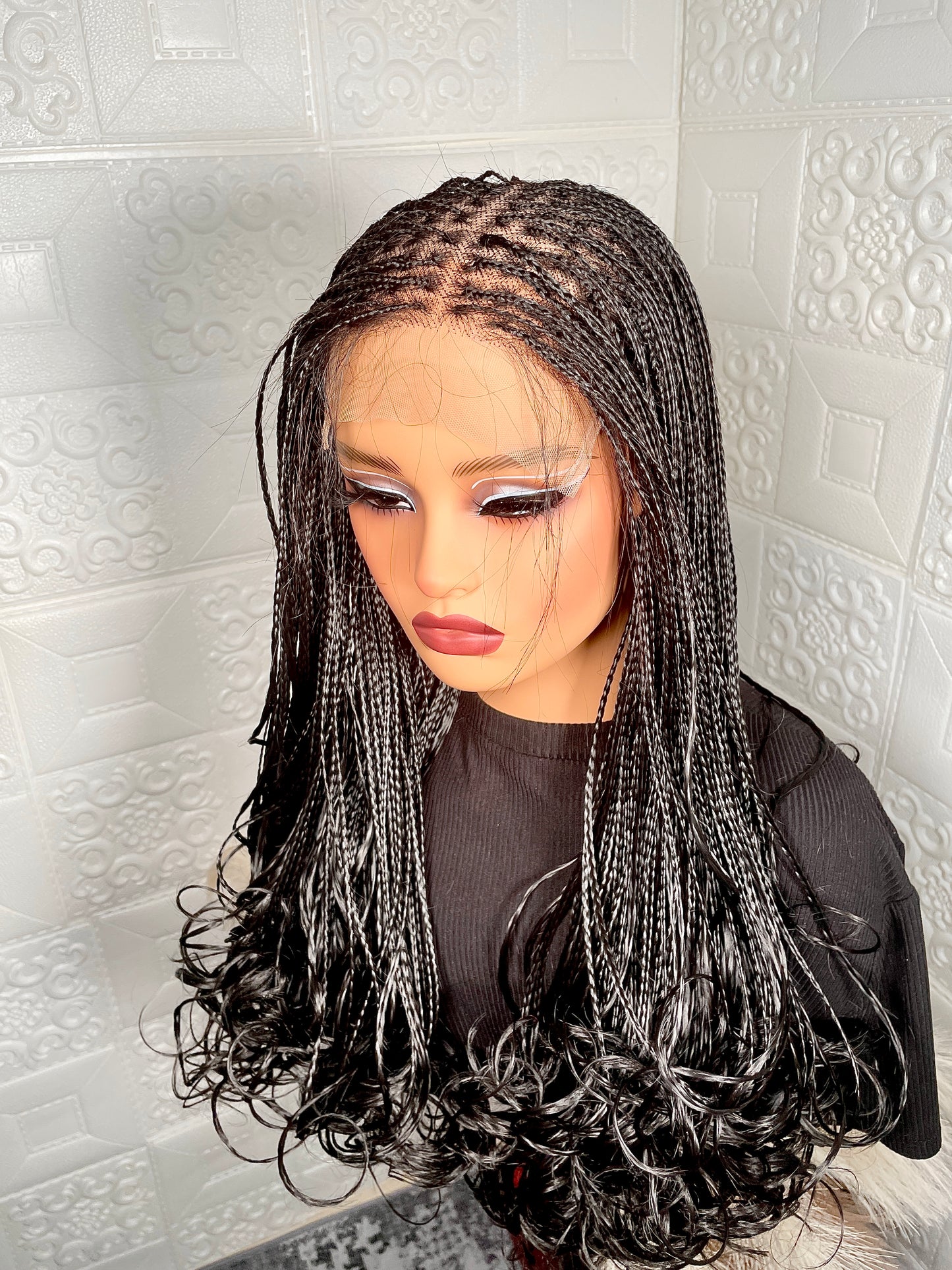 5 by 5 human hair base closure knotless braided wig in 16-18 inches long.