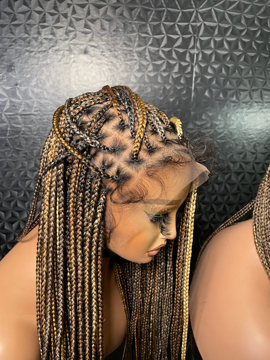 Dark blonde mix knotless braids in 30 inches, made with hair blend lace and human hair baby hair.