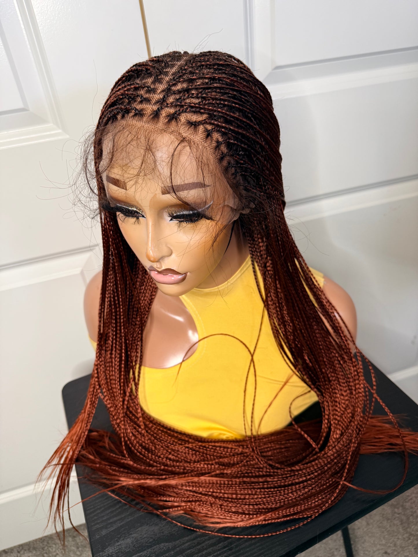 Spanish bone straight in 30 inches. made with human hair frontal lace in ginger color.