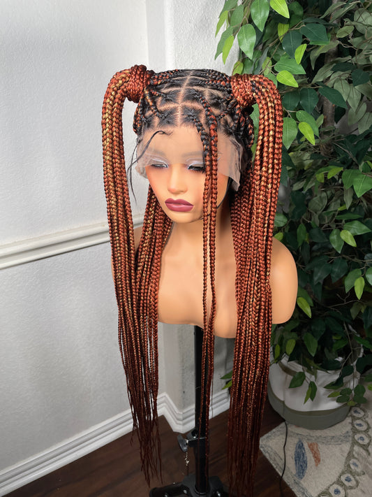 Full lace braided wig in ginger with highlights.