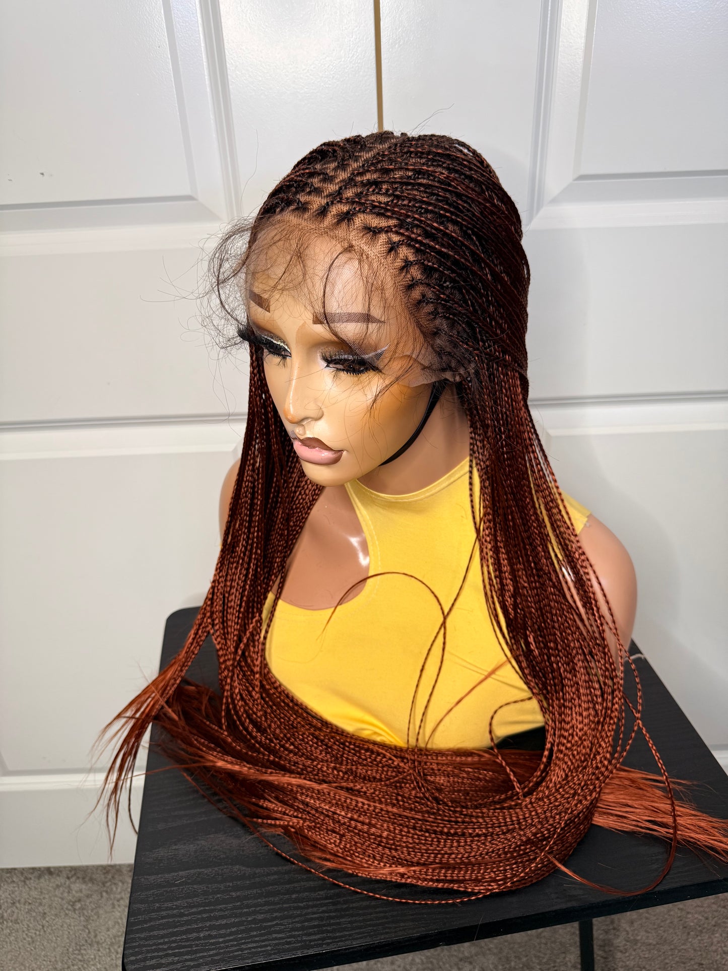 Spanish bone straight in 30 inches. made with human hair frontal lace in ginger color.