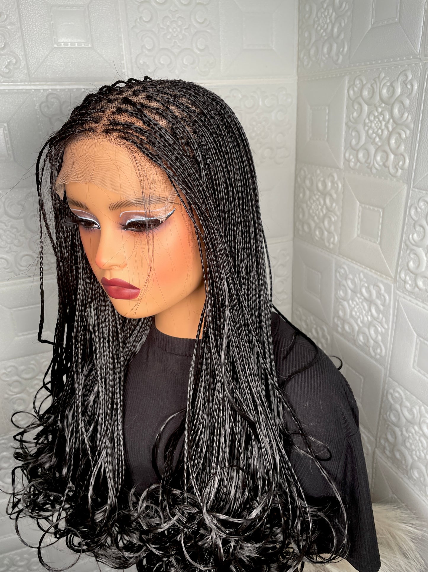 5 by 5 human hair base closure knotless braided wig in 16-18 inches long.