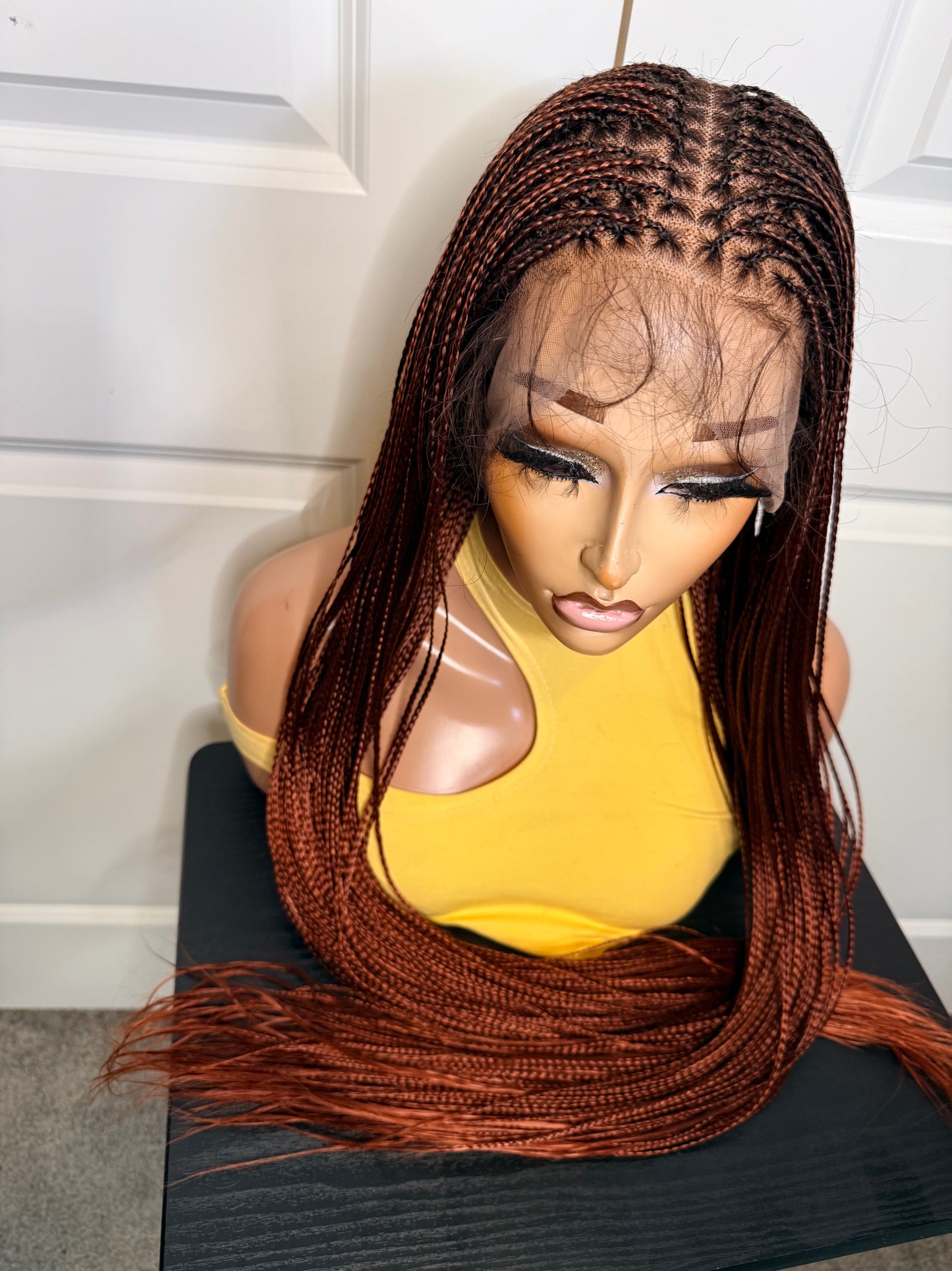 Spanish bone straight in 30 inches. made with human hair frontal lace in ginger color.