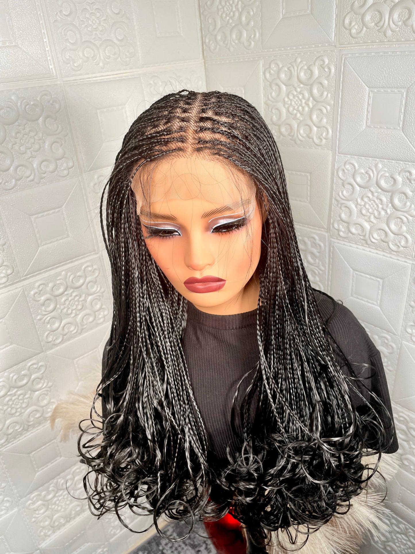 5 by 5 human hair base closure knotless braided wig in 16-18 inches long.