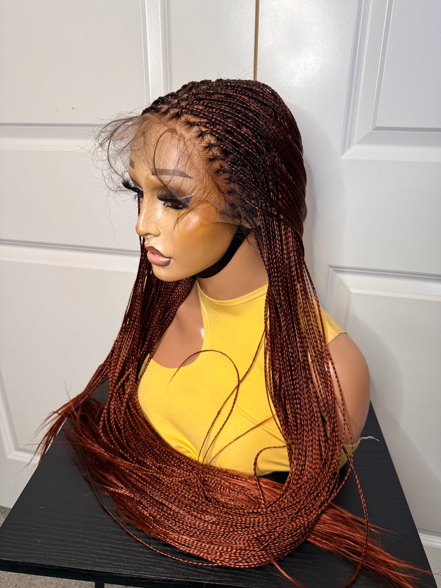 Spanish bone straight in 30 inches. made with human hair frontal lace in ginger color.