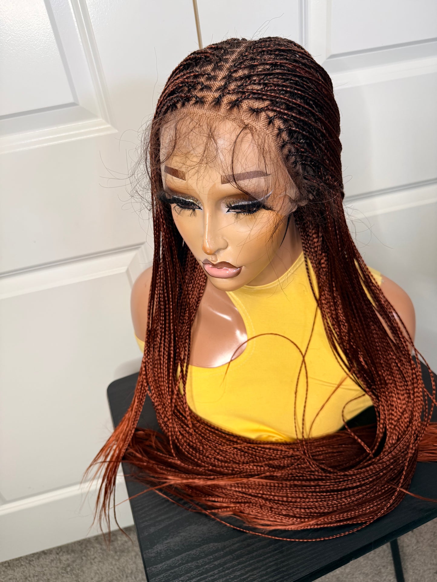 Spanish bone straight in 30 inches. made with human hair frontal lace in ginger color.