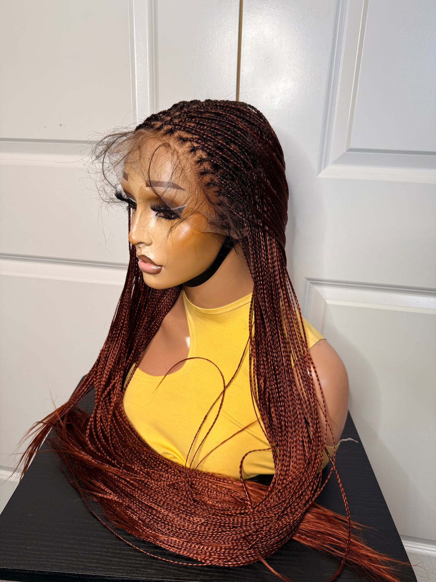 Spanish bone straight in 30 inches. made with human hair frontal lace in ginger color.